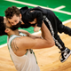 Jayson Tatum lifts his son, Deuce, after the game.